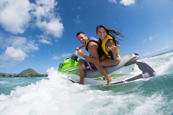 a man riding a wave on a surf board on a body of water